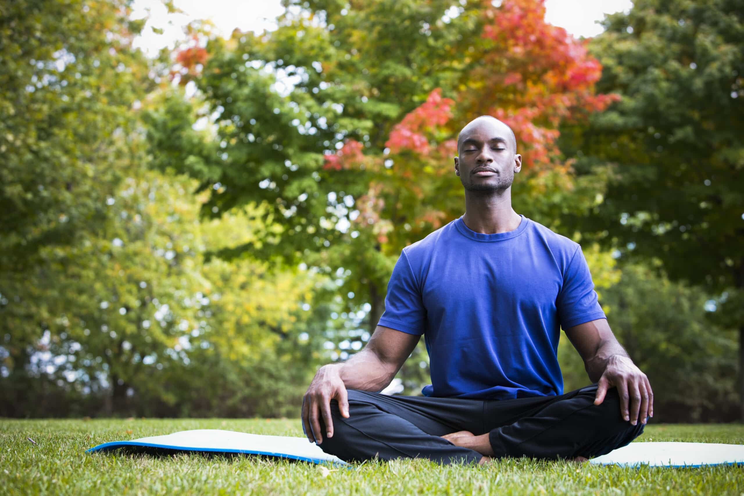 Man practicing mindfulness in nature to help cause epigenetic changes that affect the course of Gaucher disease.